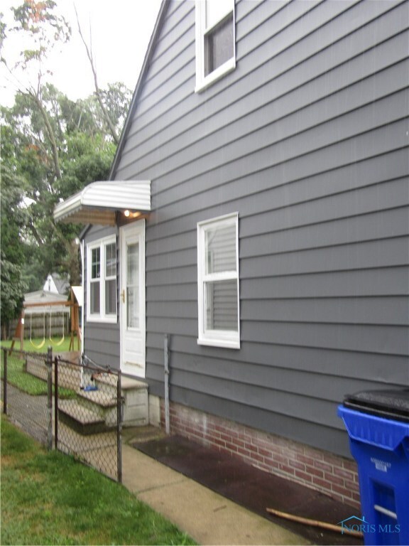 garage side of home towards back yard and entrance