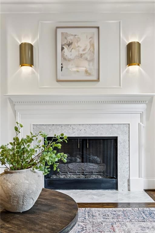 Detailed view of a high end fireplace and wood finished floors