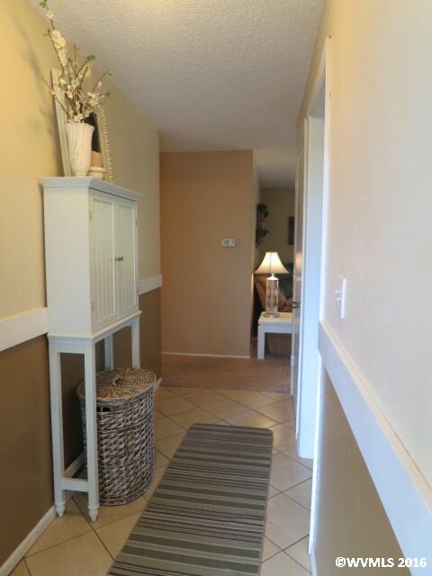 Bedrooms to the left, living room straight ahead, 
