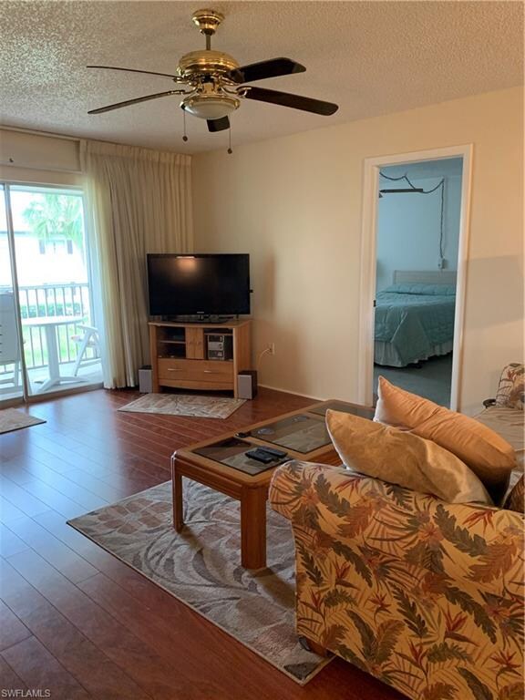 Living area looking into master bedroom.