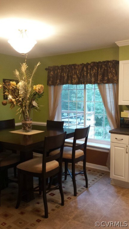 Spacious eat in kitchen with large bay window over