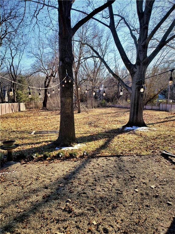 View from the side porch with loose pebble patio a