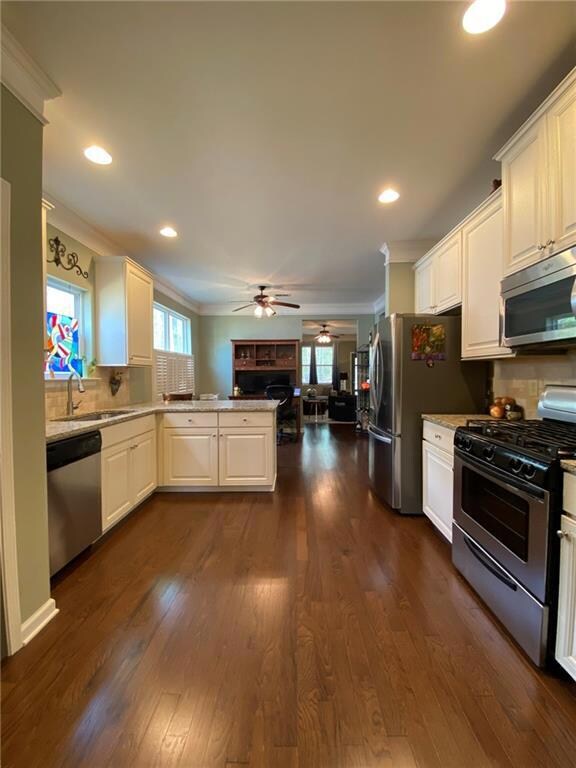 Kitchen featuring crown molding, appliances with s