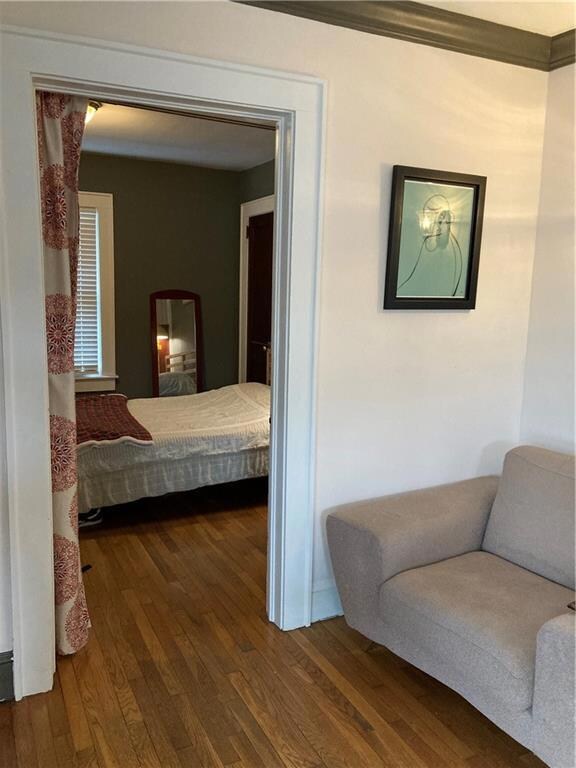 Bedroom with dark wood finished floors