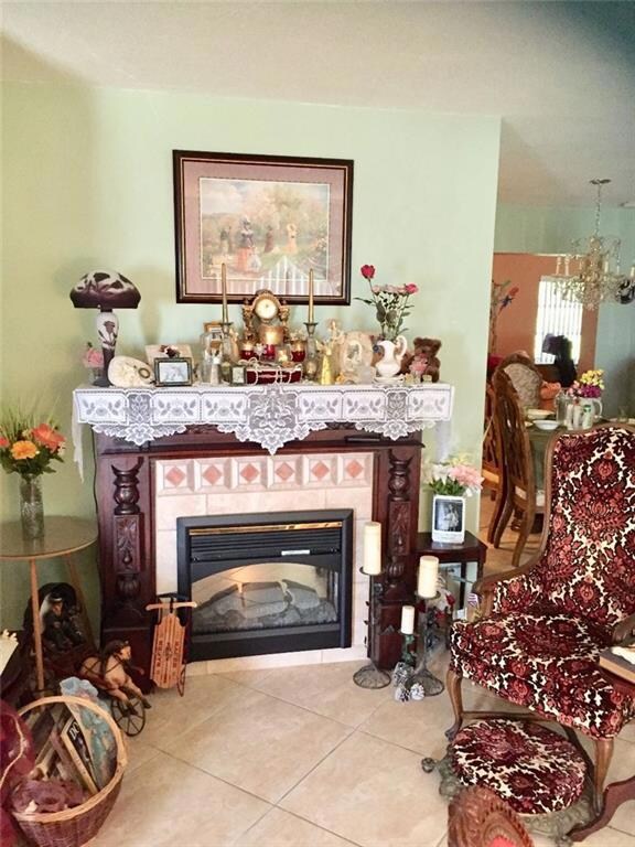 Living Room with Decorative Fireplace that has fla