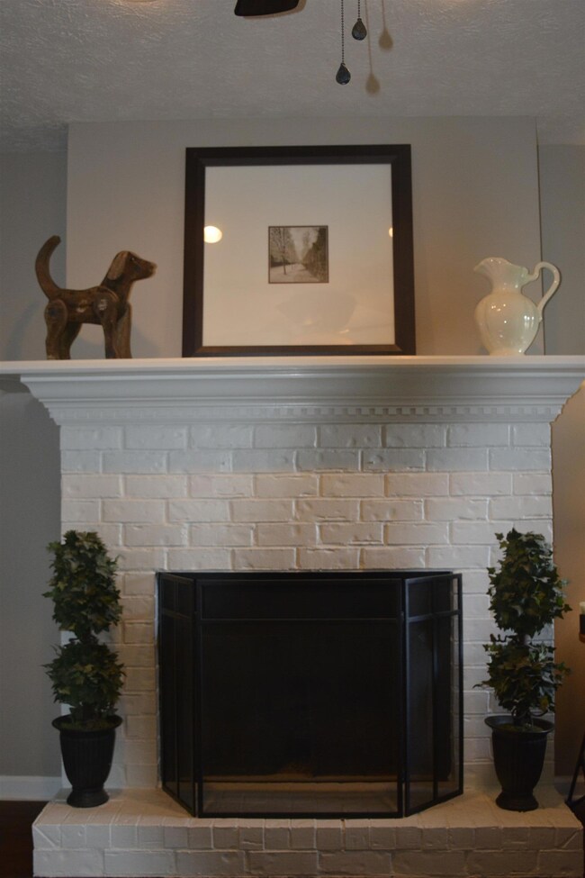Beautiful fireplace in LR w/hardwood flooring