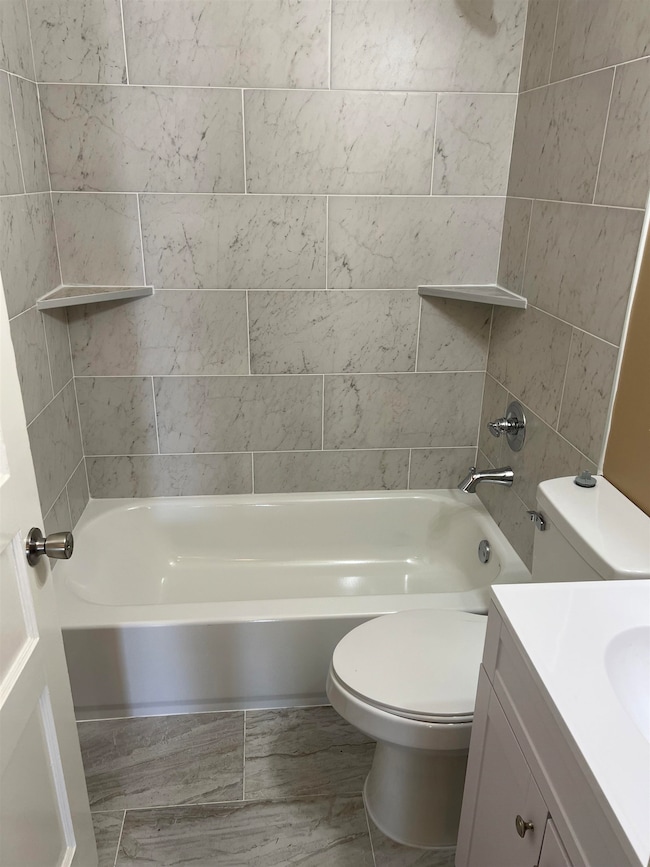 Full bath with vanity, shower / tub combination, a