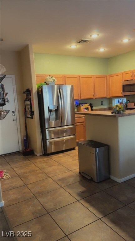 Kitchen with appliances with stainless steel finis