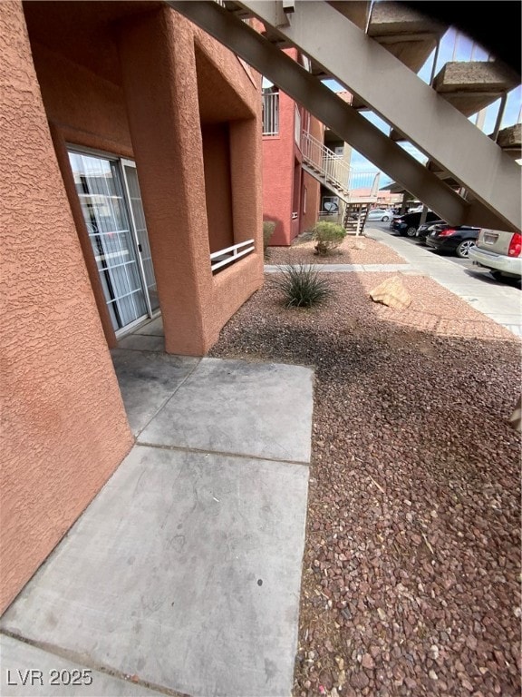 View of side of property with stucco siding