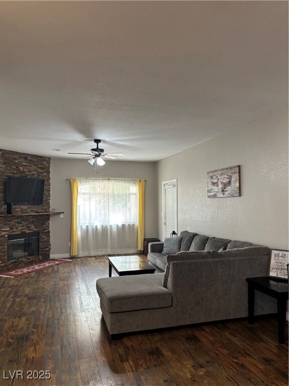 Living room with dark wood-type flooring, ceiling