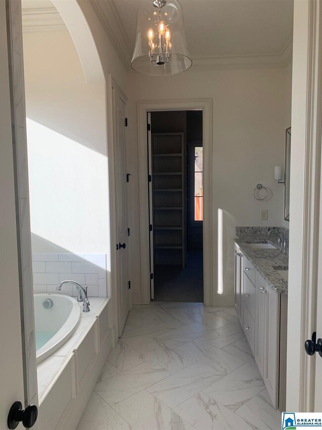 This Master Bath will stun you!  The gorgeous tile, the double vanities, walk-in shower, elegant tub!