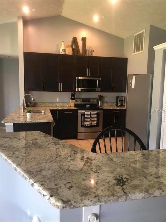 Closet pantry, breakfast bar with granite countert