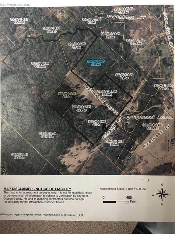 Aerial tax map; parcels included are marked with black X; total acreage outlined in black - note the northwestern border is a creek or brook. The blue highlighted parcel belongs to a different owner and sits right across from where the house is locat