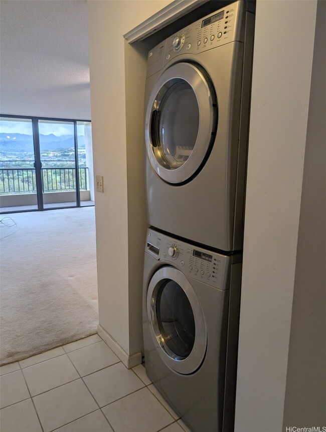 Laundry area in the hallway between the kitchen and living room