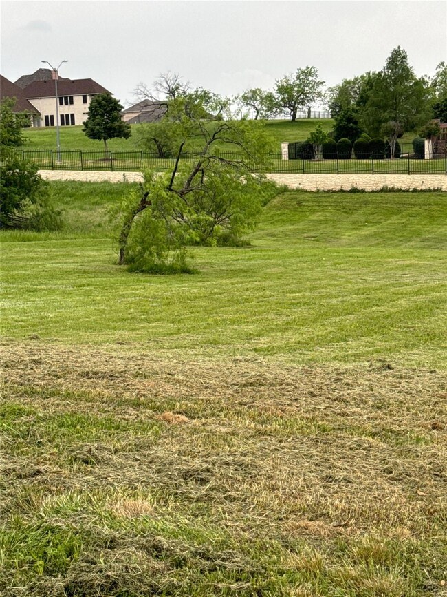 View of yard with a rural view