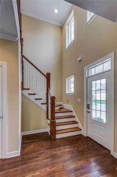 Two Story entry with hand scraped, hardwood floori