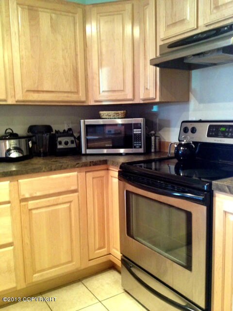 Tile floors and maple cabinets
