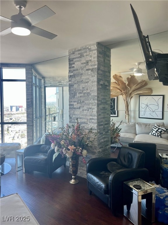 Living area with wood finished floors and a ceilin