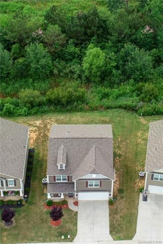 Notice the deep tree line behind this home that makes it a perfect retreat.