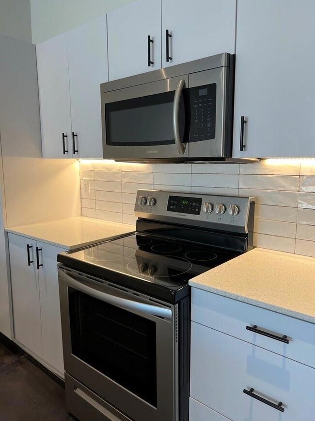 Kitchen featuring appliances with stainless steel 