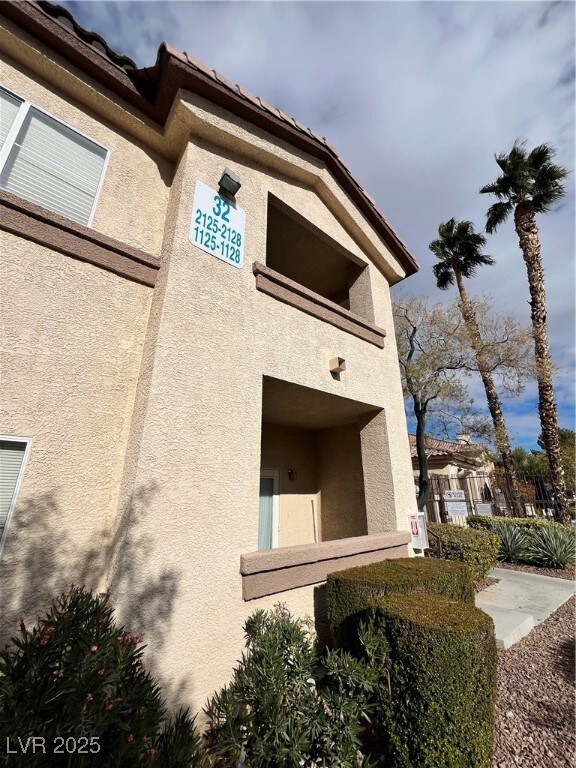 View of side of property featuring stucco siding