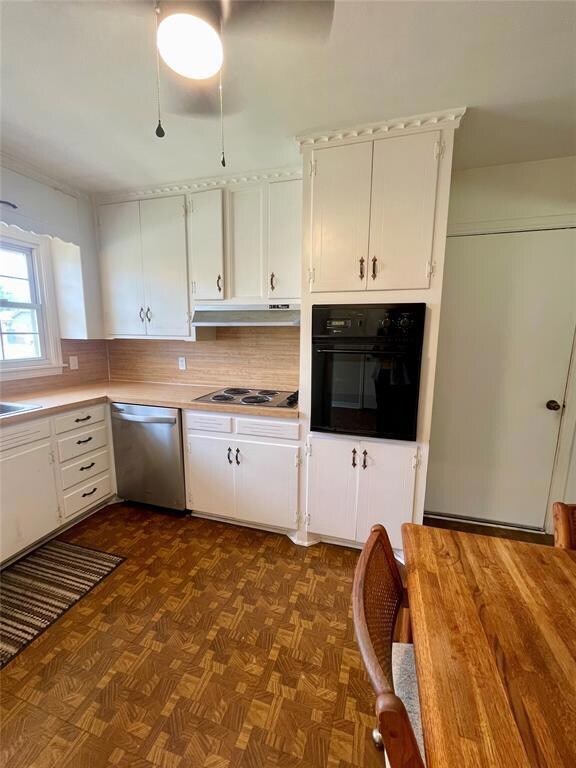 Kitchen with stainless steel dishwasher, white cab