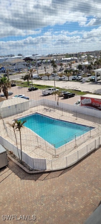 Community pool featuring fence