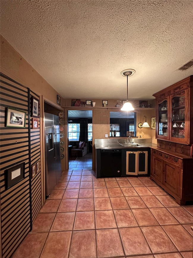 Kitchen featuring  unique sink with drain board ar