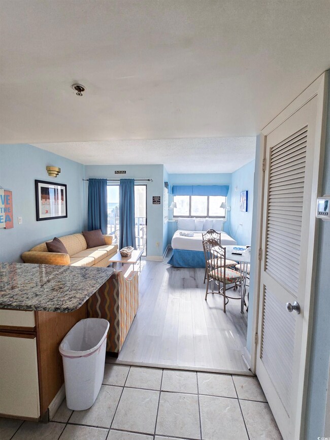 Bedroom featuring baseboards and light tile patterned floors