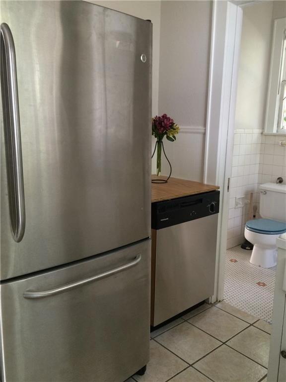 Kitchen view of stainless steel appliances, tile 