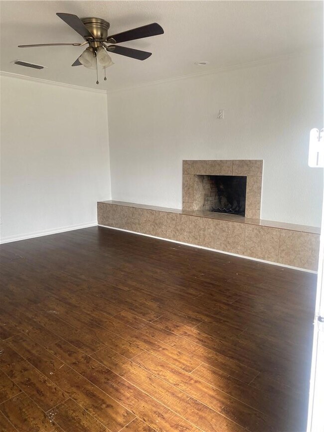 Living room with wood burning fireplace