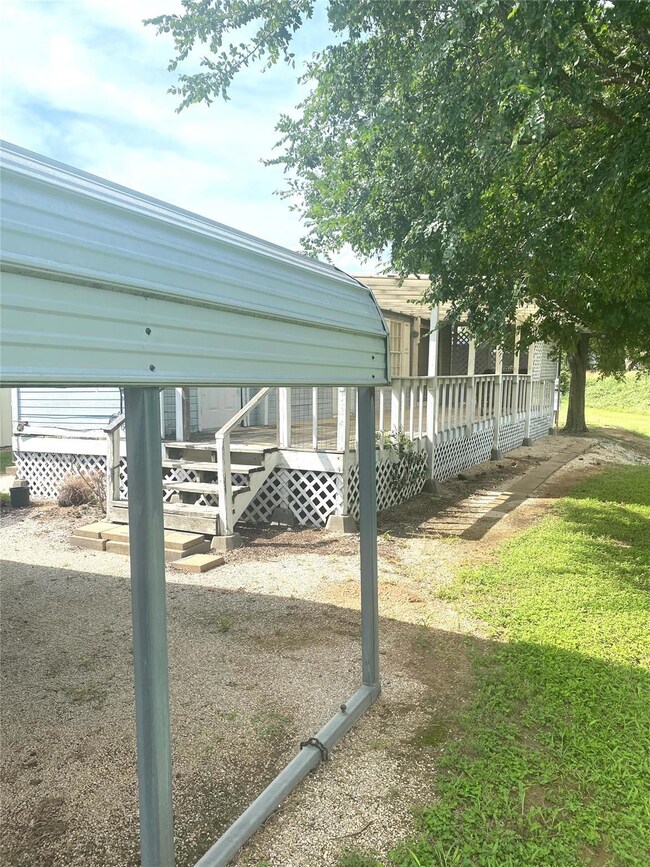 View of yard featuring a wooden deck