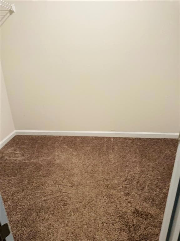 Empty room featuring carpet floors