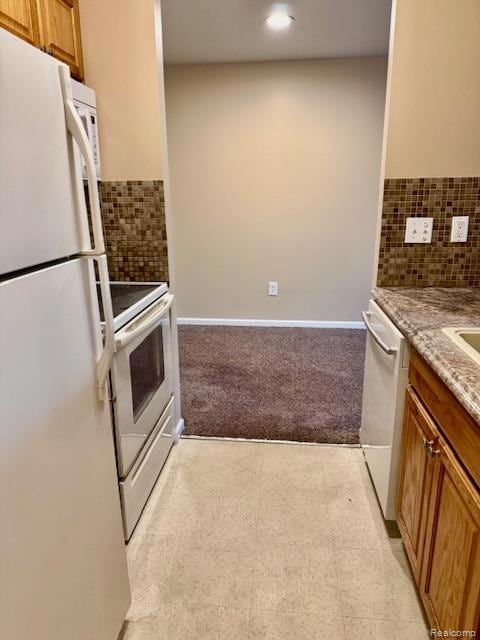 Kitchen featuring decorative backsplash, brown cabinets, white appliances, and light stone counters