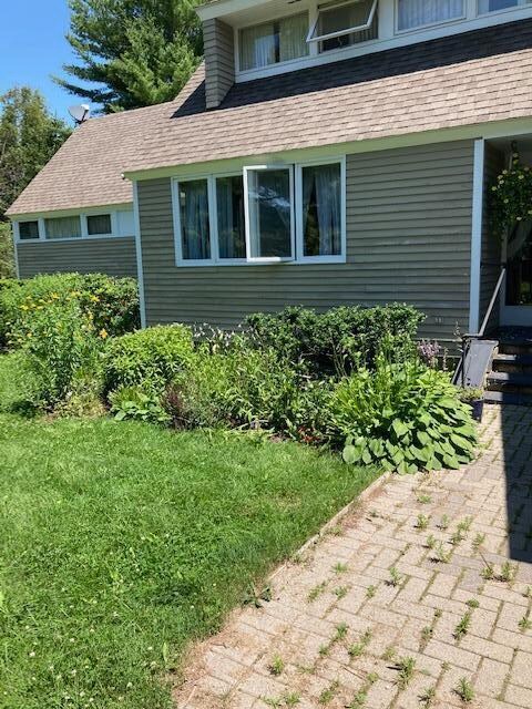 Blake front of house in summer - Copy