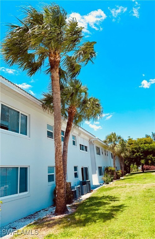 View of side of home featuring stucco siding and a