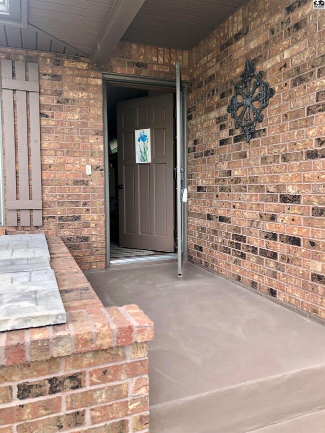 Nice covered front door entry with planter box.