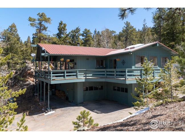 Front view with trailer parking under deck and to the side of the deck.