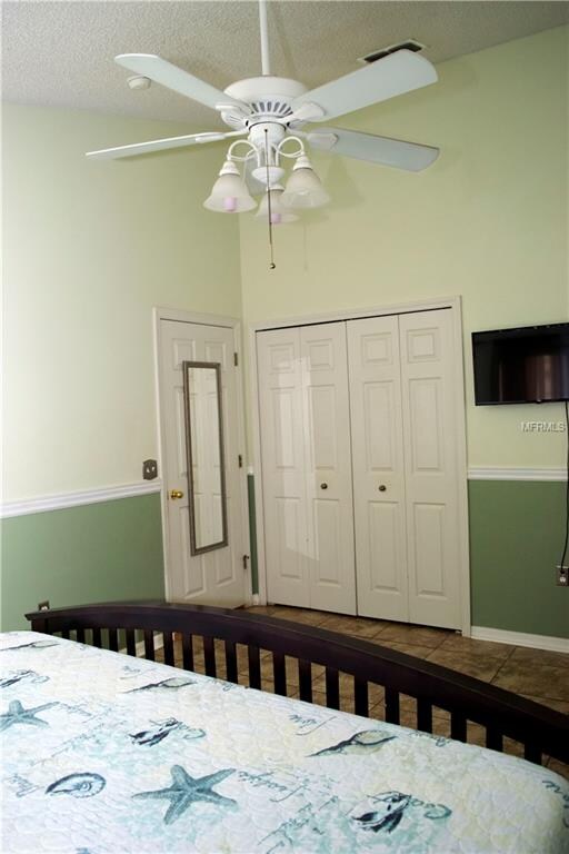 Tile flooring in Master Bedroom with walk in close