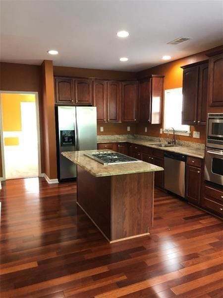 Kitchen featuring dark wood-style floors, visible 