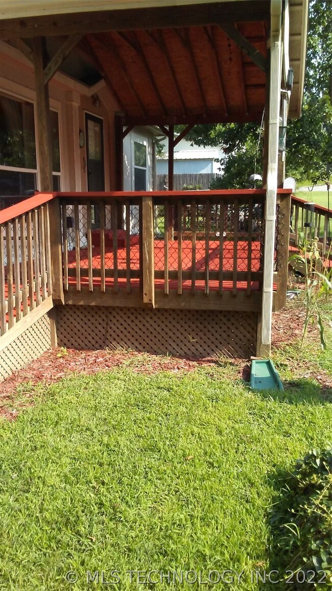 East side covered front deck, completely fenced in