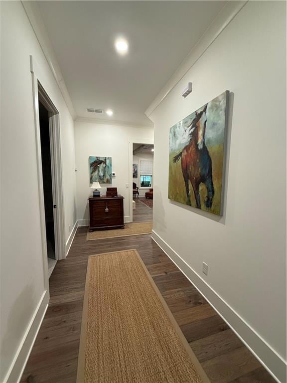 Hallway featuring baseboards, ornamental molding, 