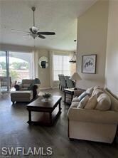Living room with lofted ceiling, a wealth of natur