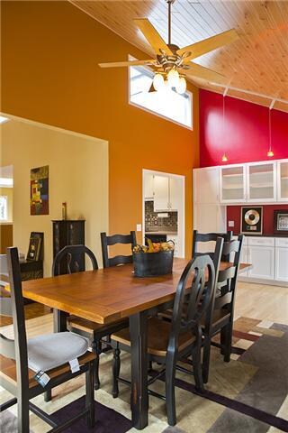 A second view of the dining room depicts the abundance of natural light which permeates the home.
