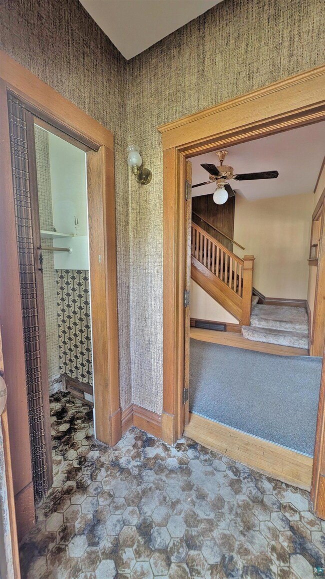 Interior space featuring tile flooring and ceiling