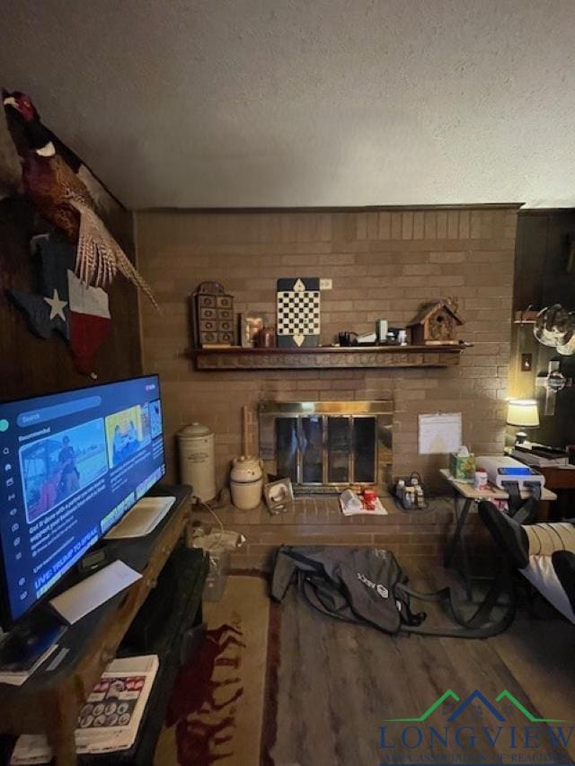 Living room featuring a textured ceiling and wood 