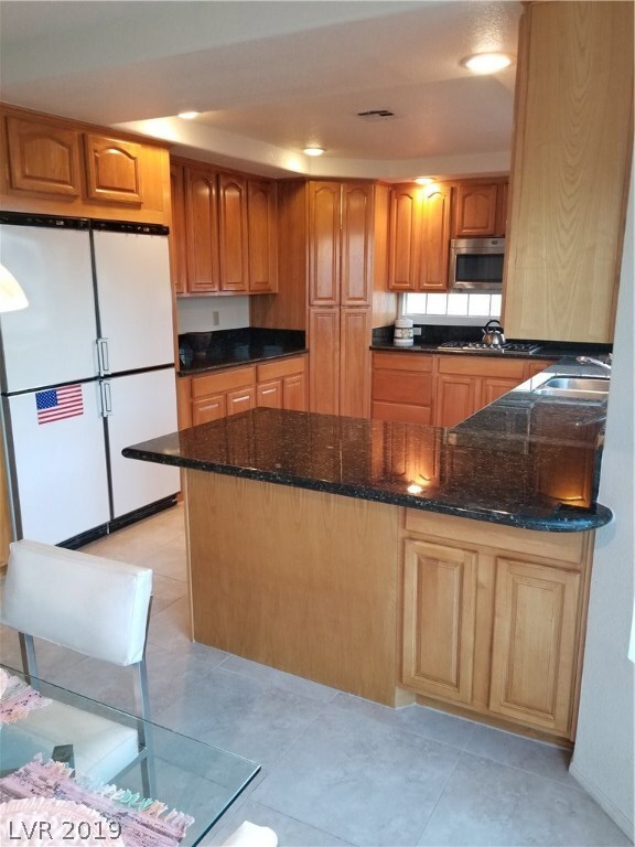 Kitchen with double refrigerator, double freezer,