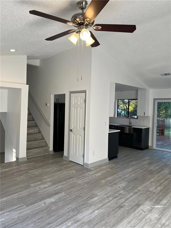 Unfurnished living room featuring light hardwood /