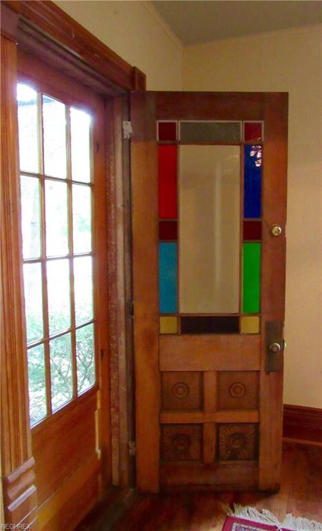 Beautiful old oak trim and stained glass doors beg