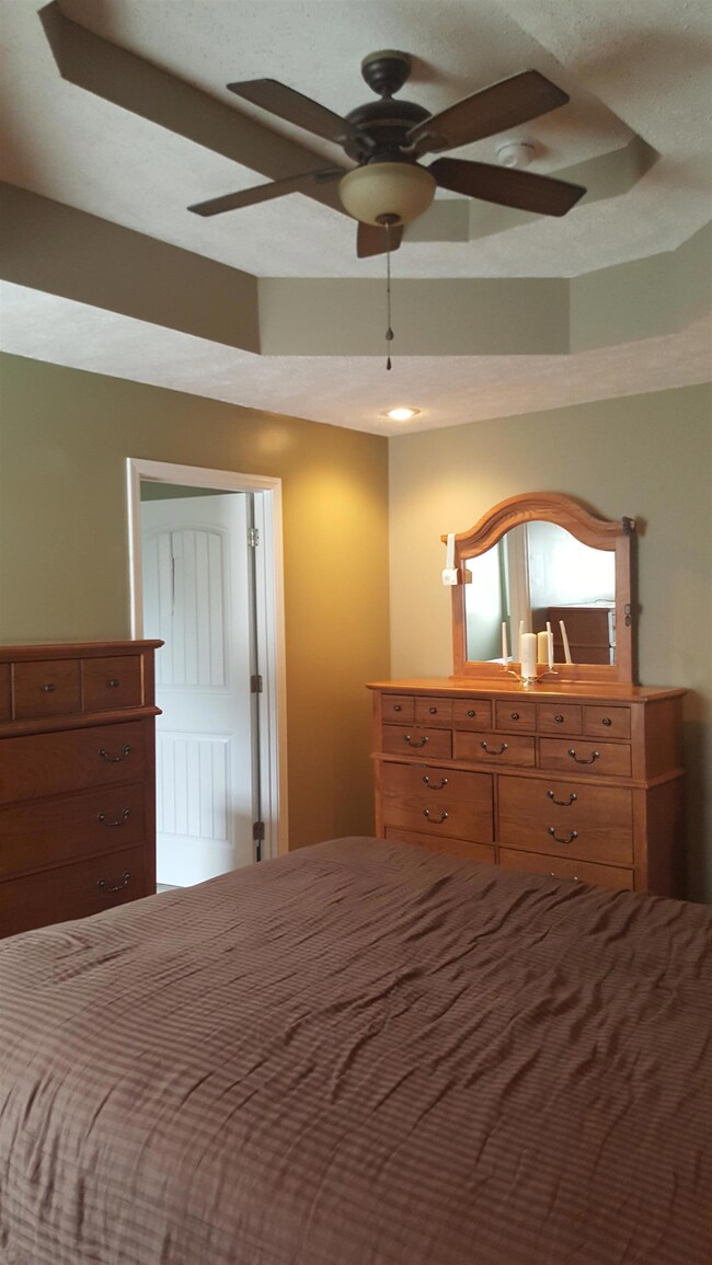 Master bedroom offers the double trey ceilings as well with plenty of space for bed and furniture alike.